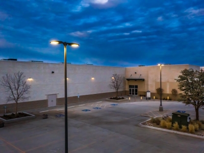 Exterior of Hillside Church alternate entrance at early evening, in Lubbock, Texas, with exterior commercial lighting.