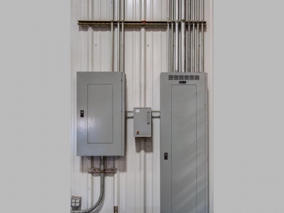Interior warehouse at Lubbock industrial provider with specialty electrical work, control panels and conduits.